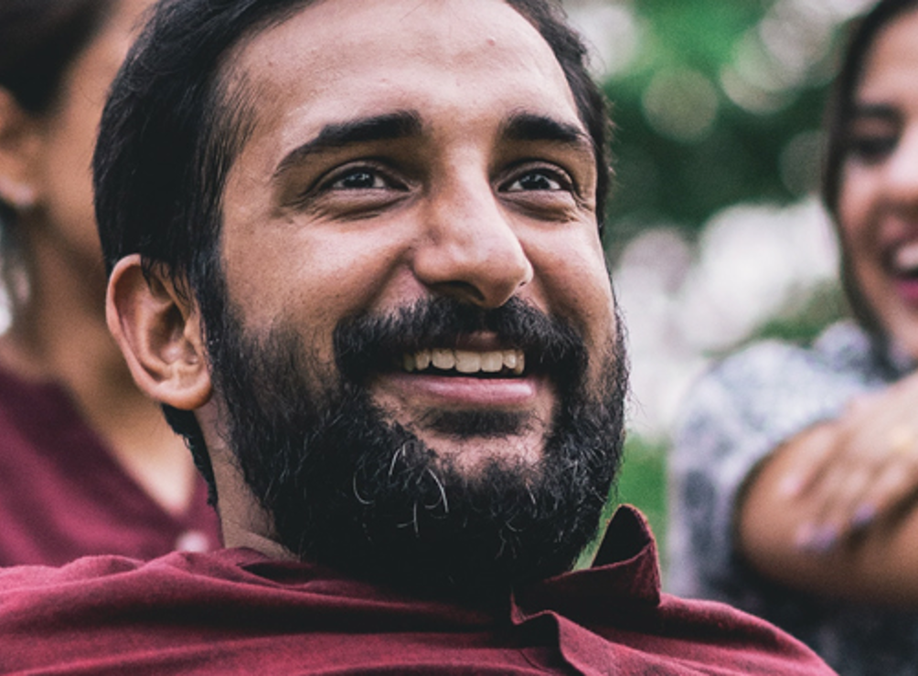 Man smiling outside.
